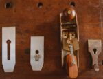 arrangement of jointer and knives on wooden table