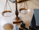 legal scales, law gavel on wooden desk