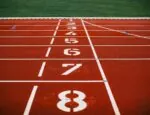 white-and-red runners race track start line