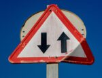 traffic sign with up and down directional arrows