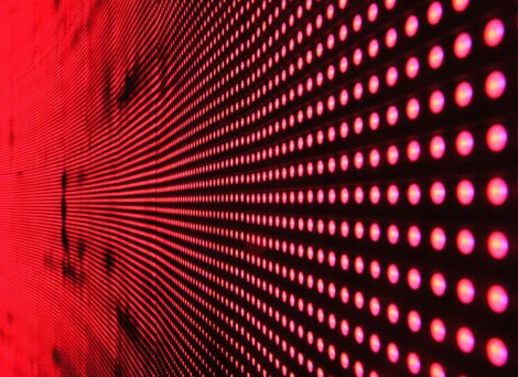 red dots lit up against a black background