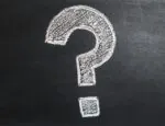 question mark drawn in white chalk on black chalkboard