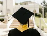 student with graduation hat and gown