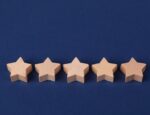 five wooden stars on dark blue background